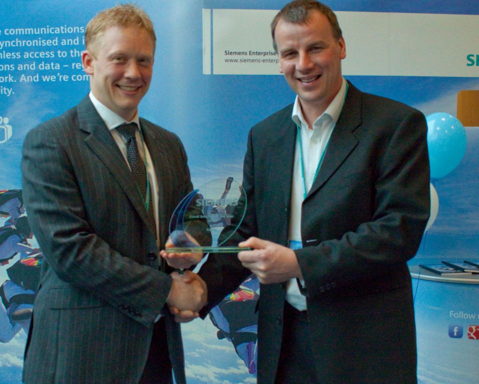 L-R: Siemens' Tony Smith presents the Reseller of the Year award to Datasharp's Allan Williamns