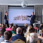 Mark Smith and David Gram on stage at Unlocking PotentialÔÇÖs Connect Event