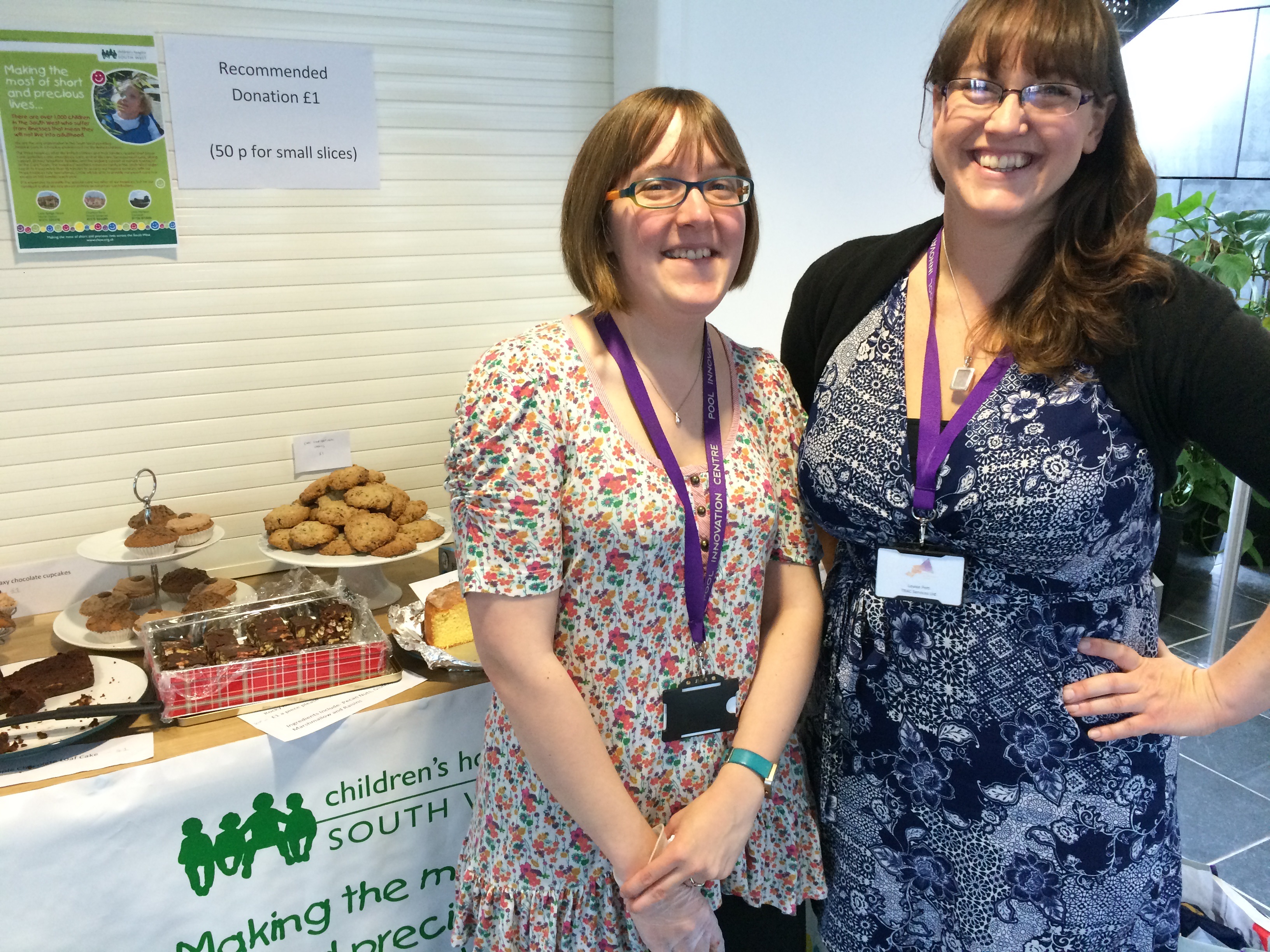 TRAC Services' Kirsty Cotton (left) and Louise Pett at the cake sale for Children's Hospice South West, which raised £600
