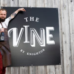 Head chef Gavin Allan standing with The Vine sign
